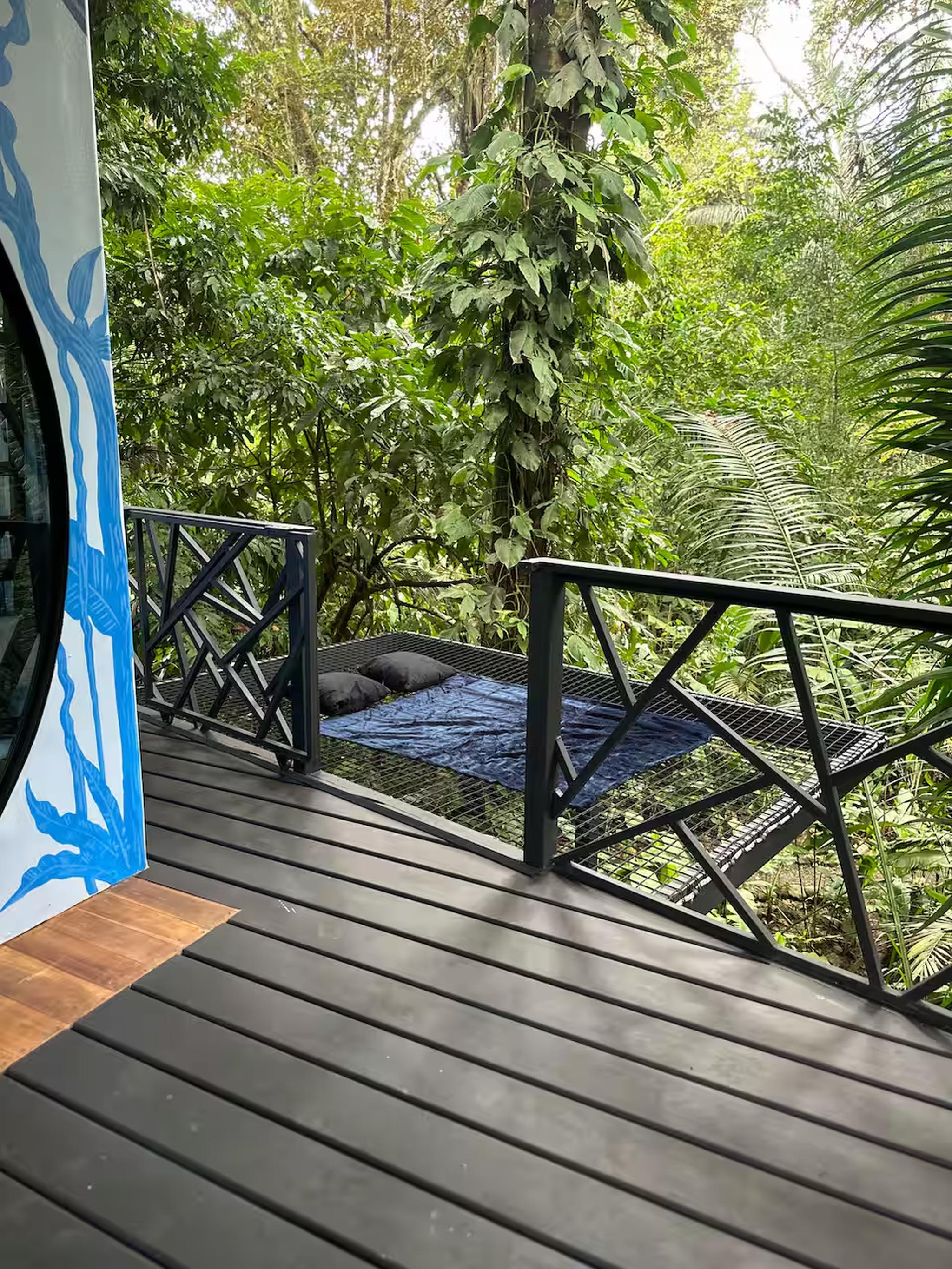 Private jungle-view deck with a cozy hammock lounge