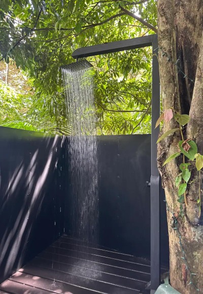 Private tropical outdoor shower with a serene spa-like feel