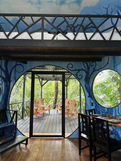 Artful jungle-view retreat with a private deck and relaxing outdoor seating