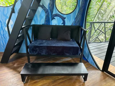 Artistic jungle-view lounge with balcony access and bold modern design