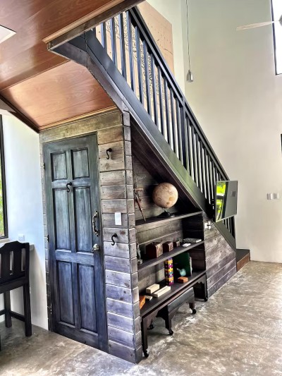 Custom wood staircase with stylish built-ins and rustic-modern charm