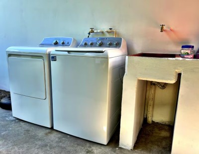 Convenient on-site washer, dryer, and utility sink for easy stays