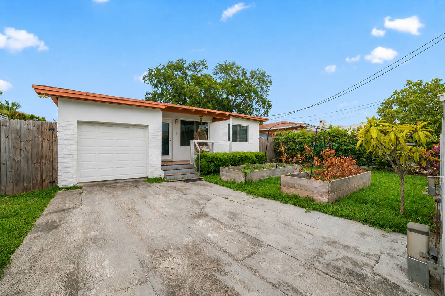 Charming curb appeal meets exceptional outdoor living, featuring a welcoming front porch, landscaped gardens, and a spacious backyard perfect for entertaining and relaxation.