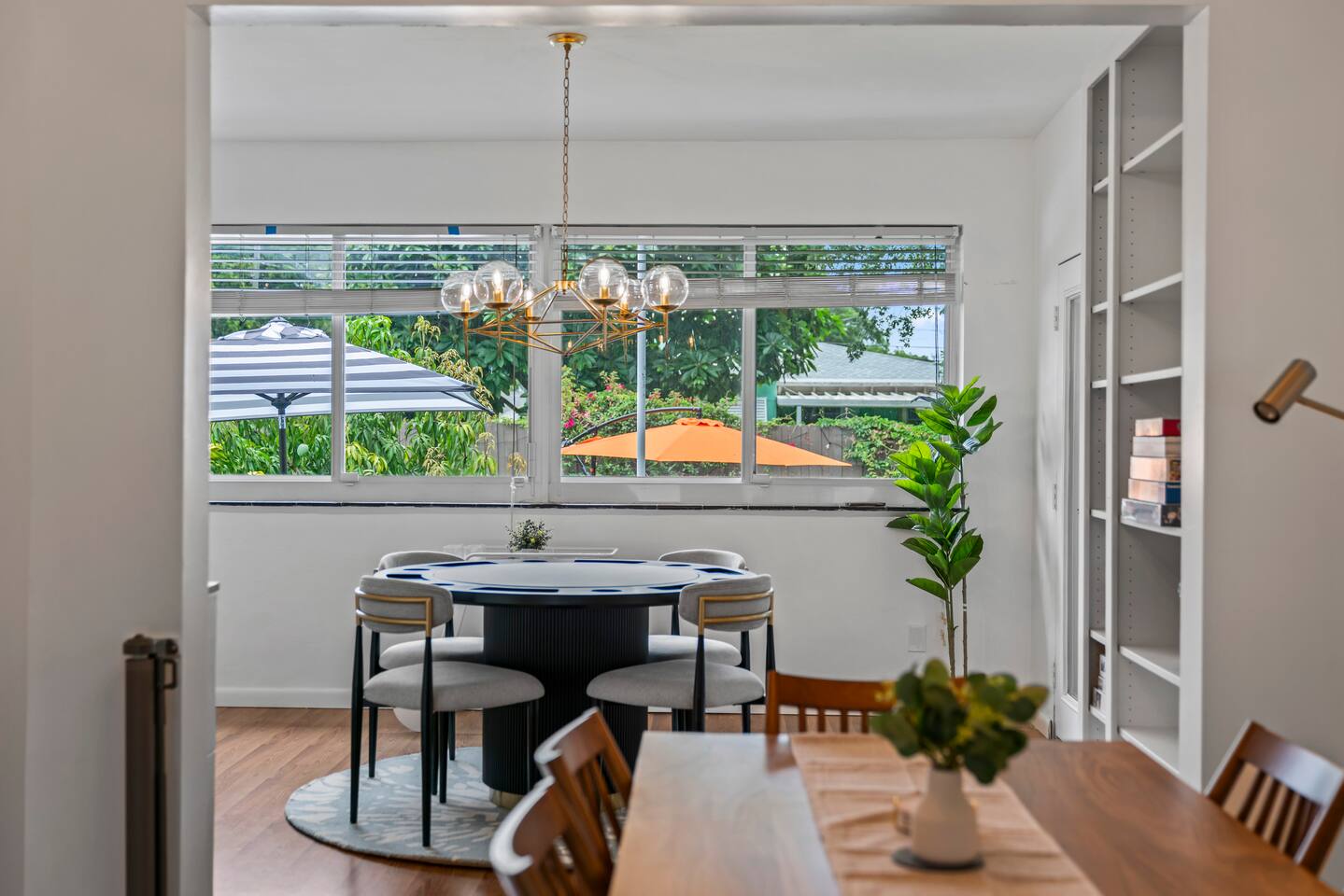 Gather, dine, and play in this sun-filled space overlooking the backyard.