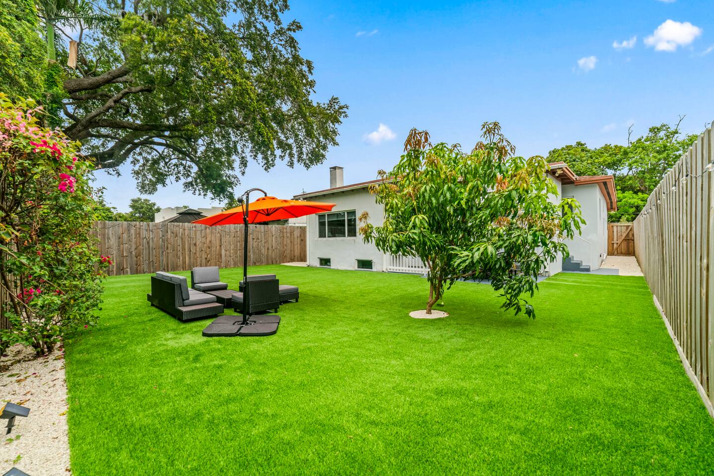 Enjoy resort-style outdoor living with expansive green space, comfortable lounge areas, and inviting dining patios.