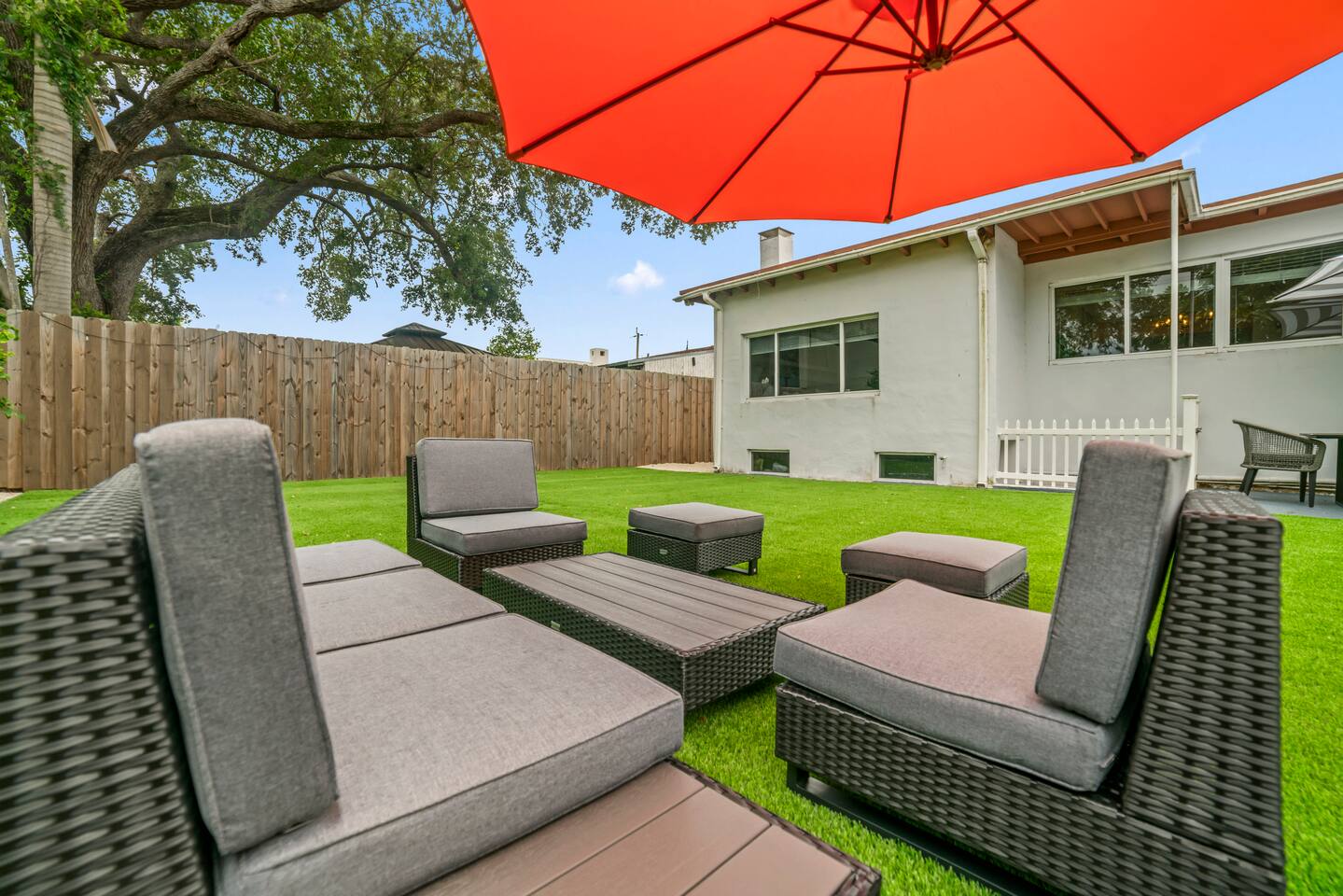 Exceptional outdoor living awaits with multiple spaces to relax, dine, and entertain amidst beautifully landscaped grounds.