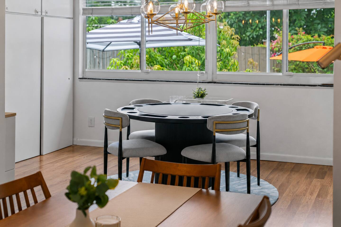 Relax and play your favorite card games with peaceful backyard views. The tabletop can be flipped upside down to create a flat surface for your board game or dining needs.