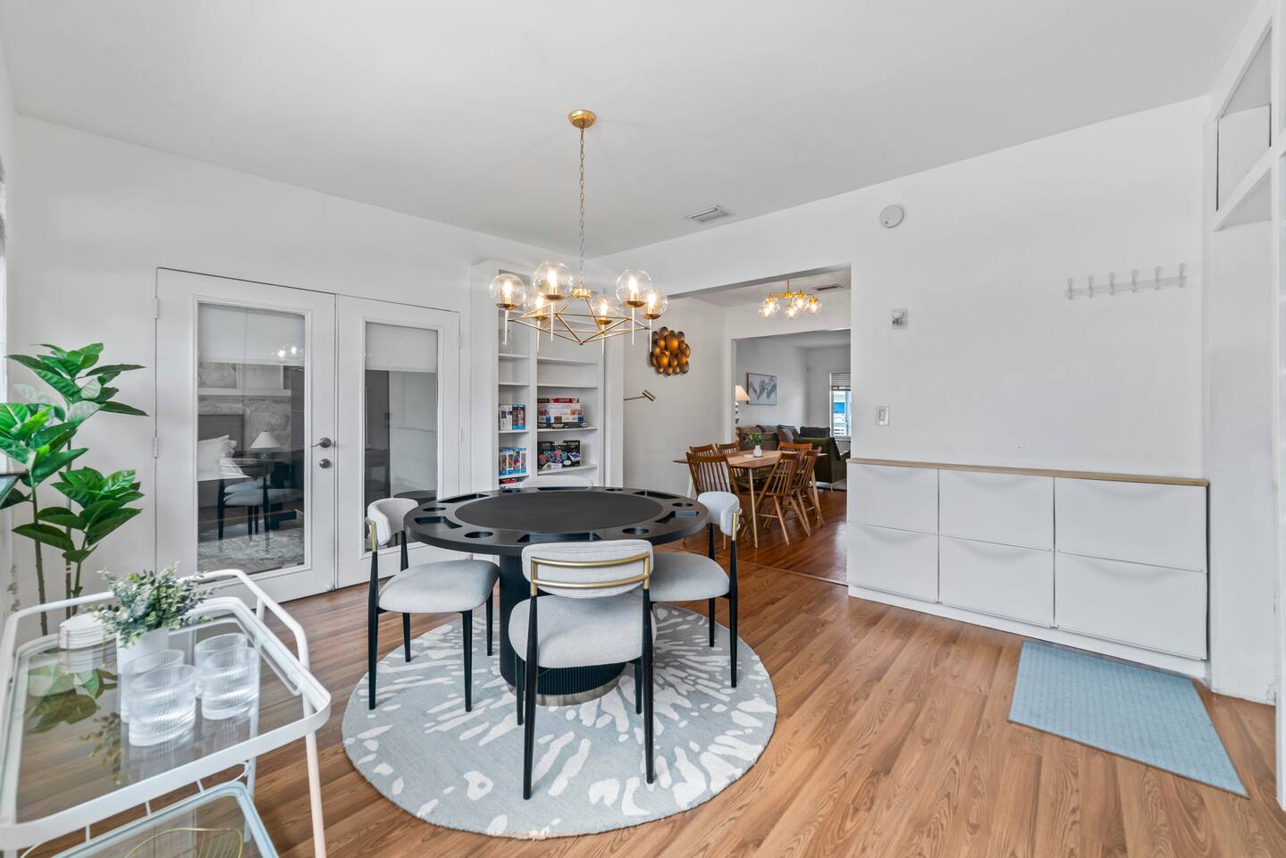 Gather around the stylish poker table for cards, games, or casual dining with family and friends.