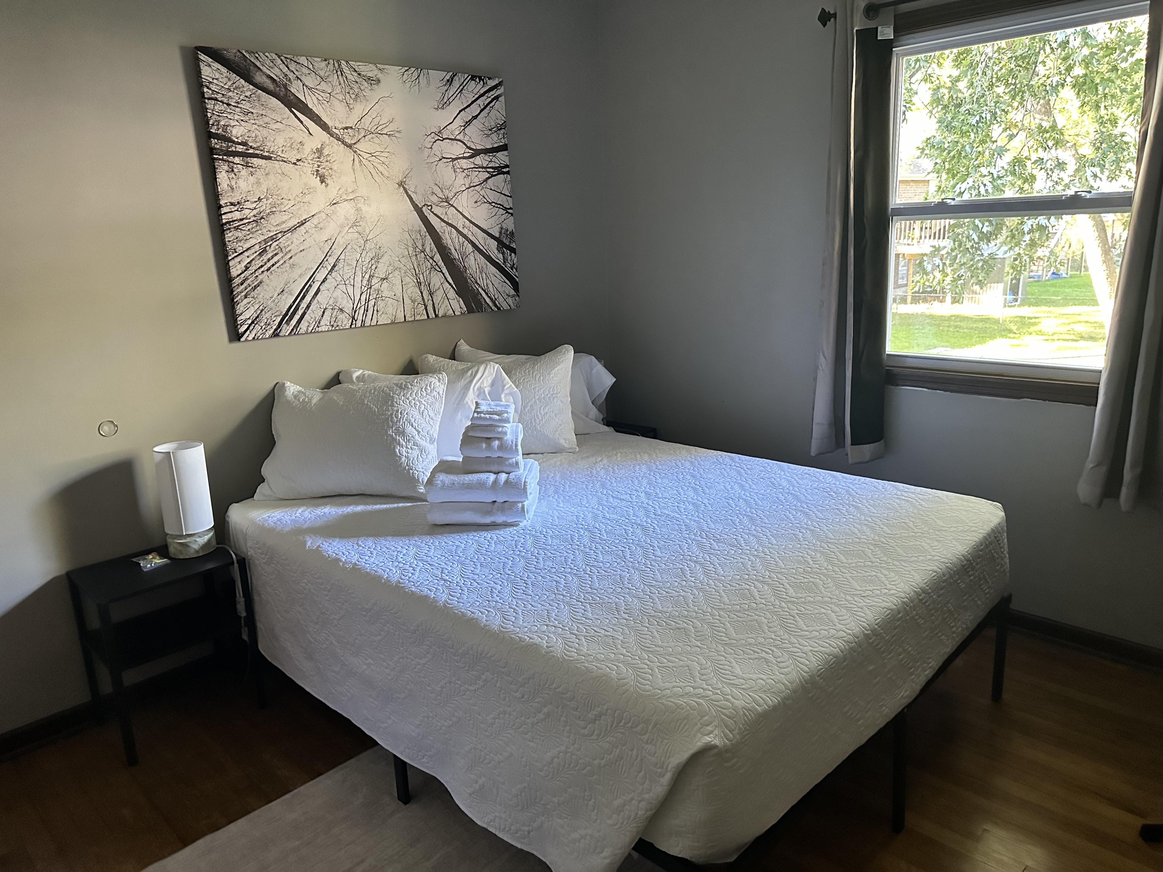 Bright, cozy bedroom with fresh linens and peaceful natural light