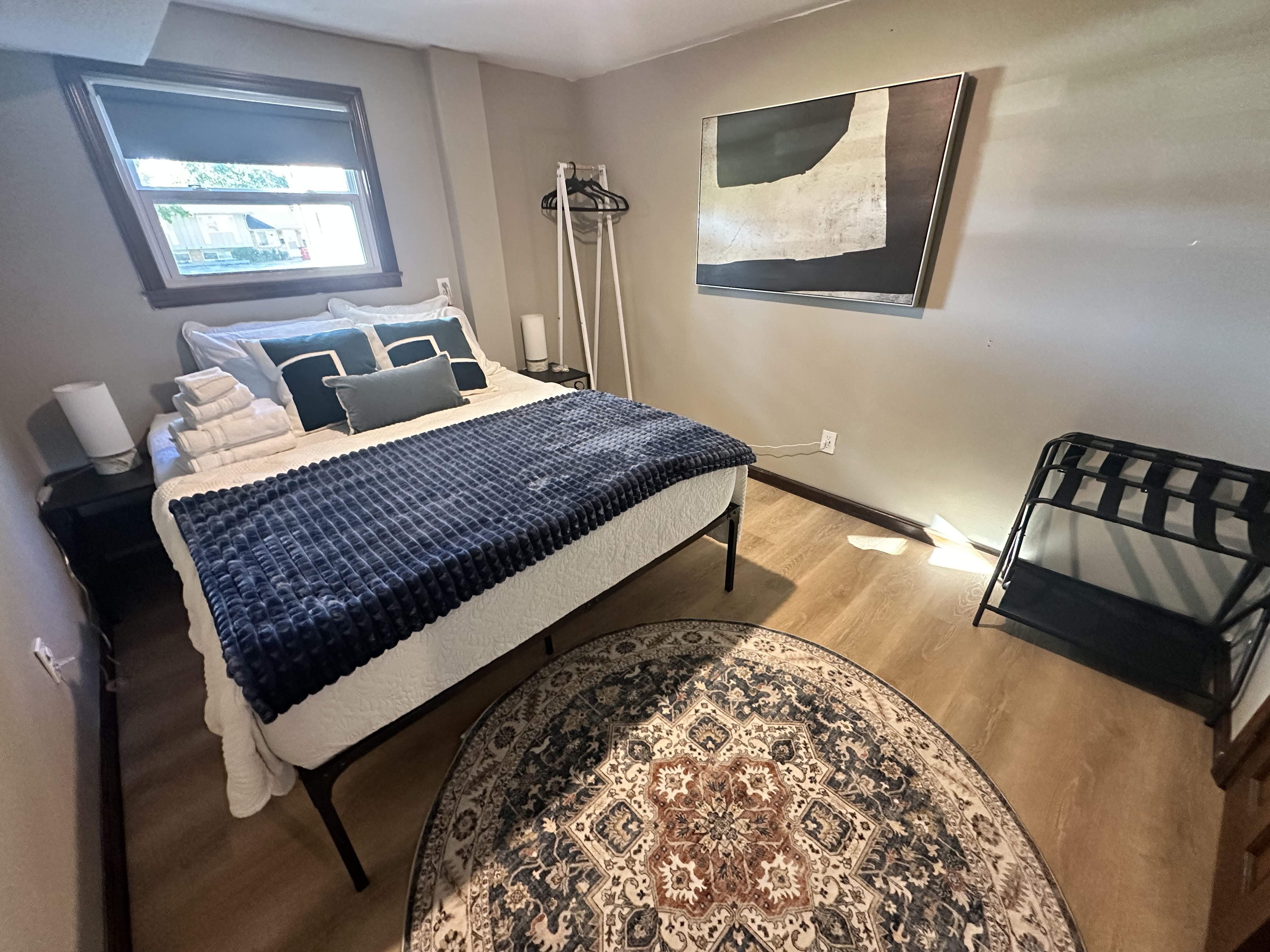 Cozy, guest-ready bedroom with stylish decor and practical touches