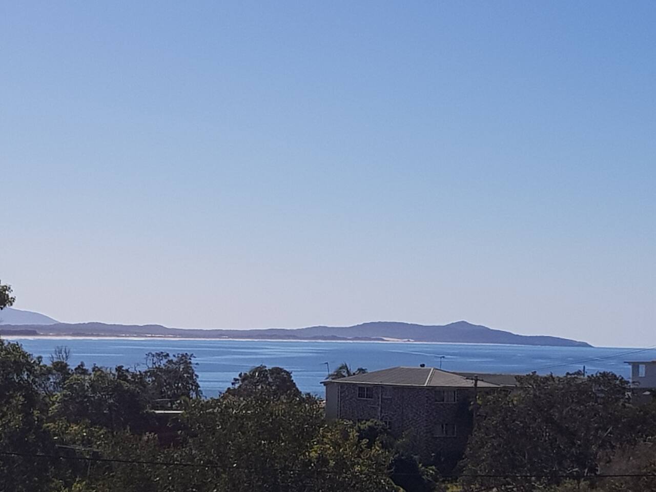 The view south from the Crescent Head headland over the bay toward Hat Head