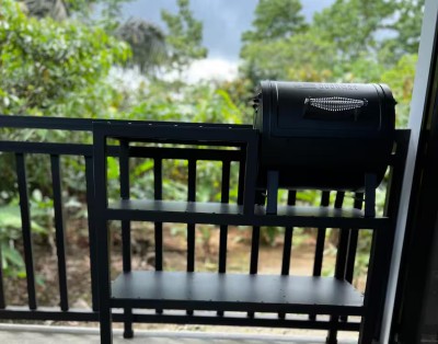 Private balcony grill with lush tropical views for easy outdoor dining