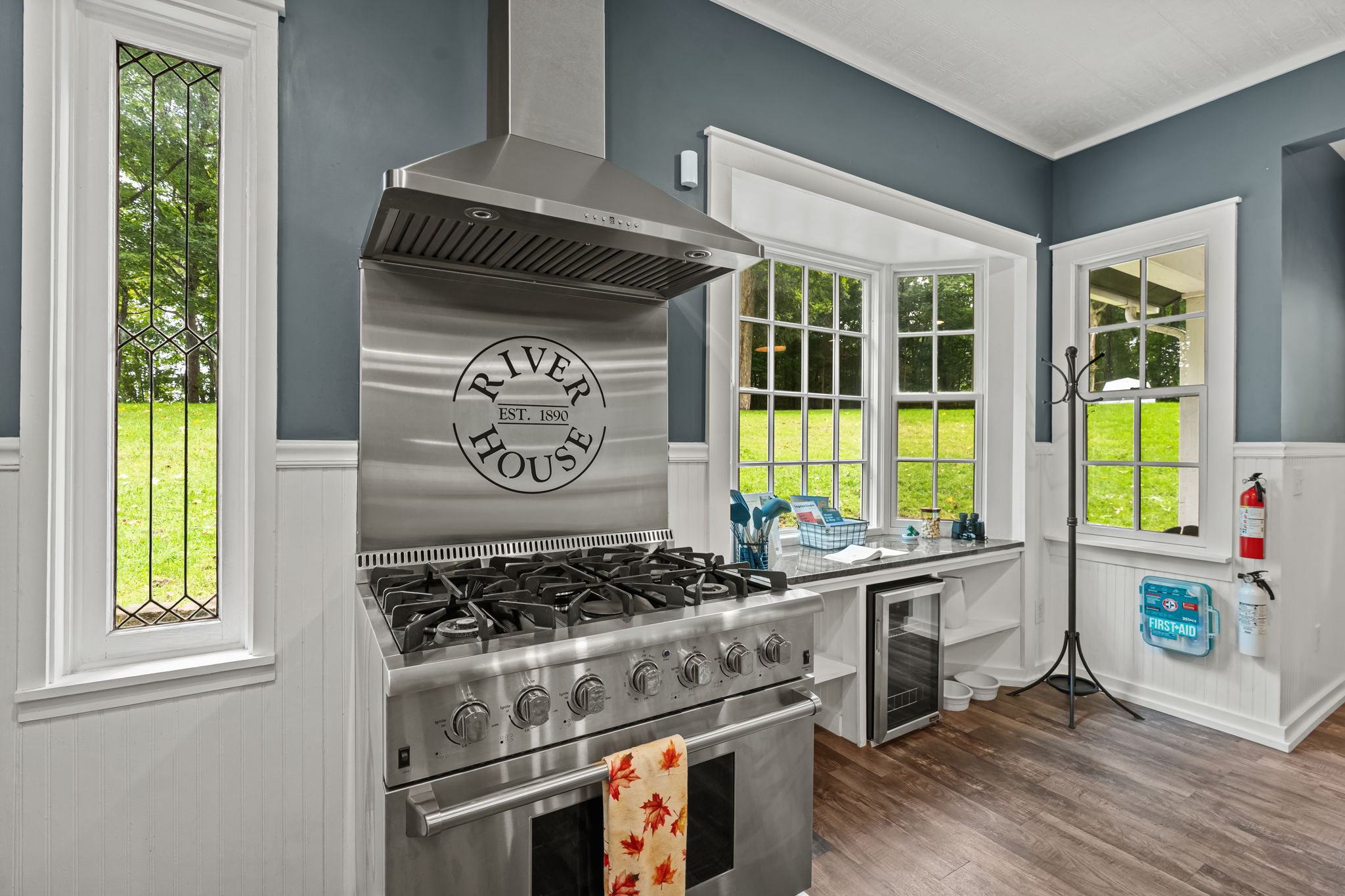 Bright gourmet kitchen with pro-grade gas range and sunny window nook