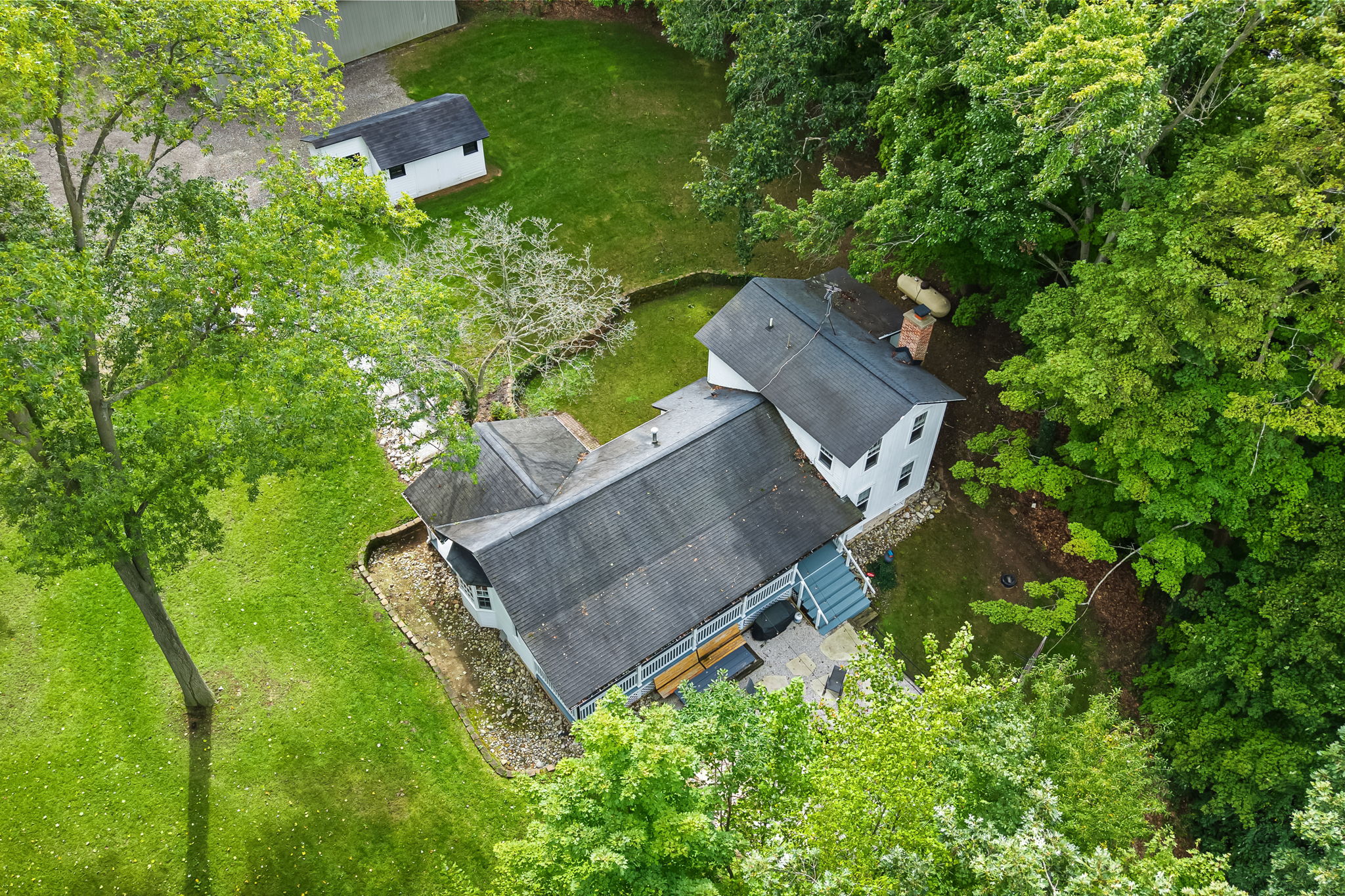 Private tree-lined retreat with a spacious yard and peaceful outdoor space