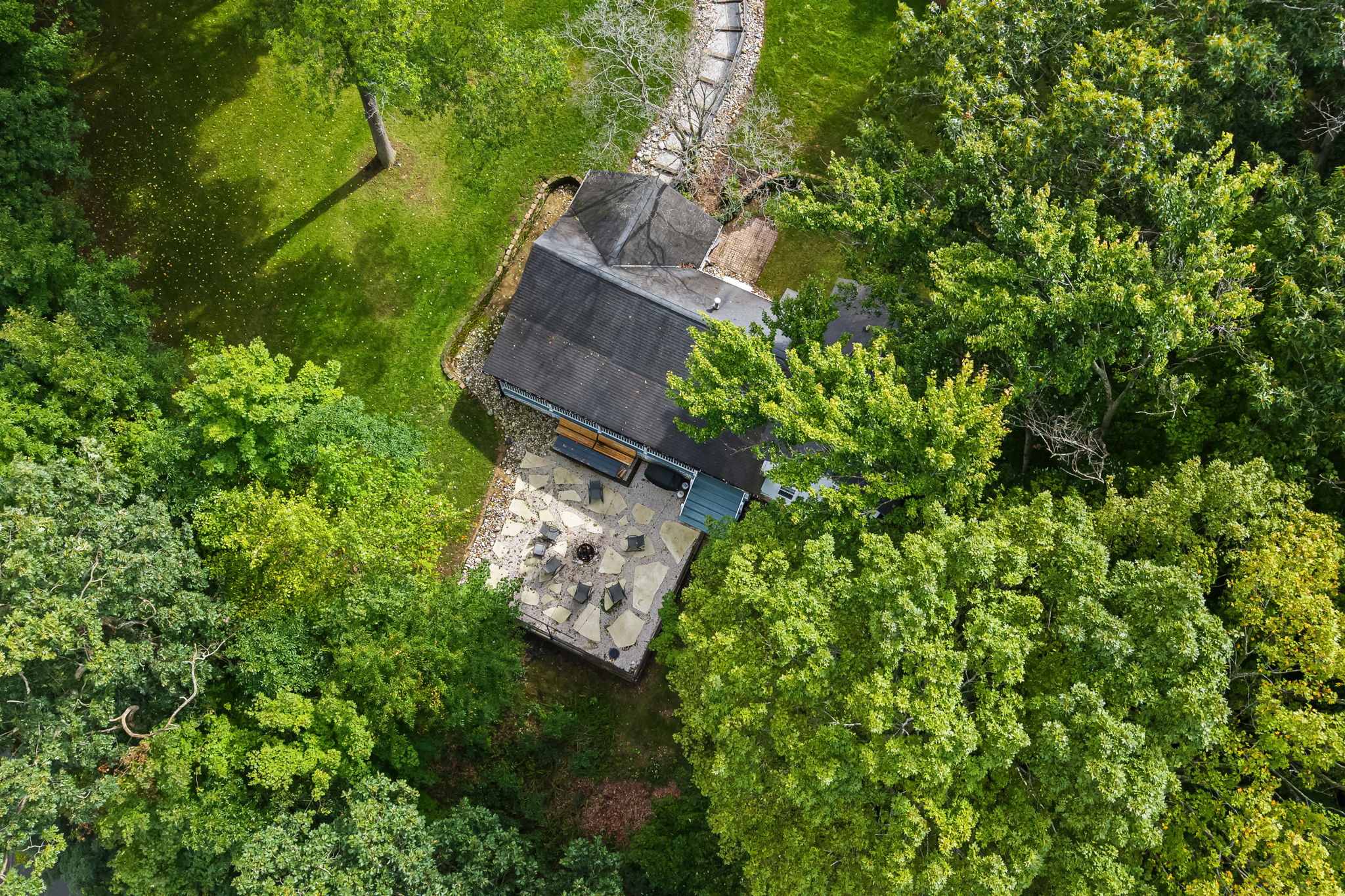 Private woodland retreat with a spacious patio and serene outdoor setting