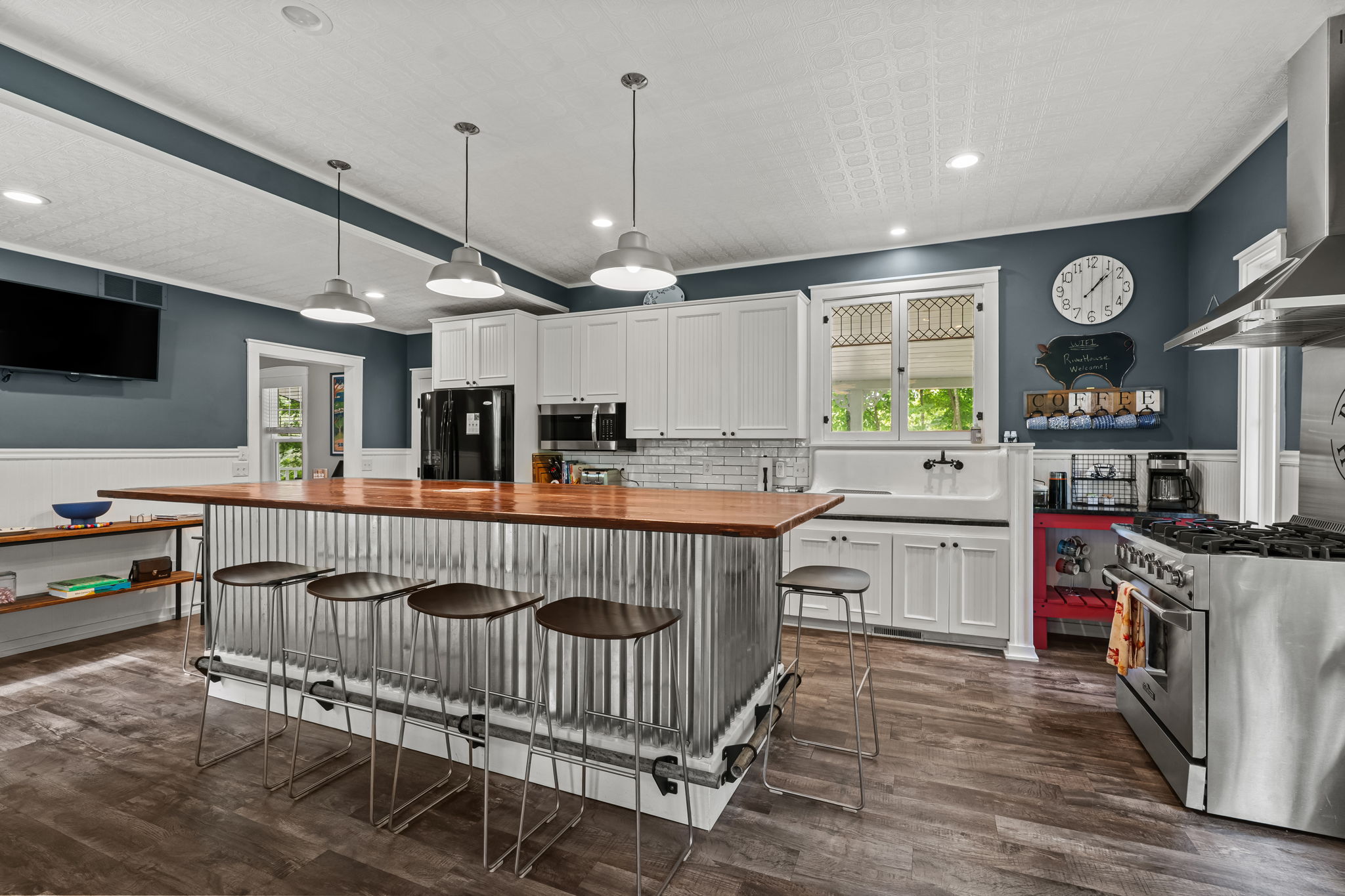 Spacious modern farmhouse kitchen with large island and bar seating