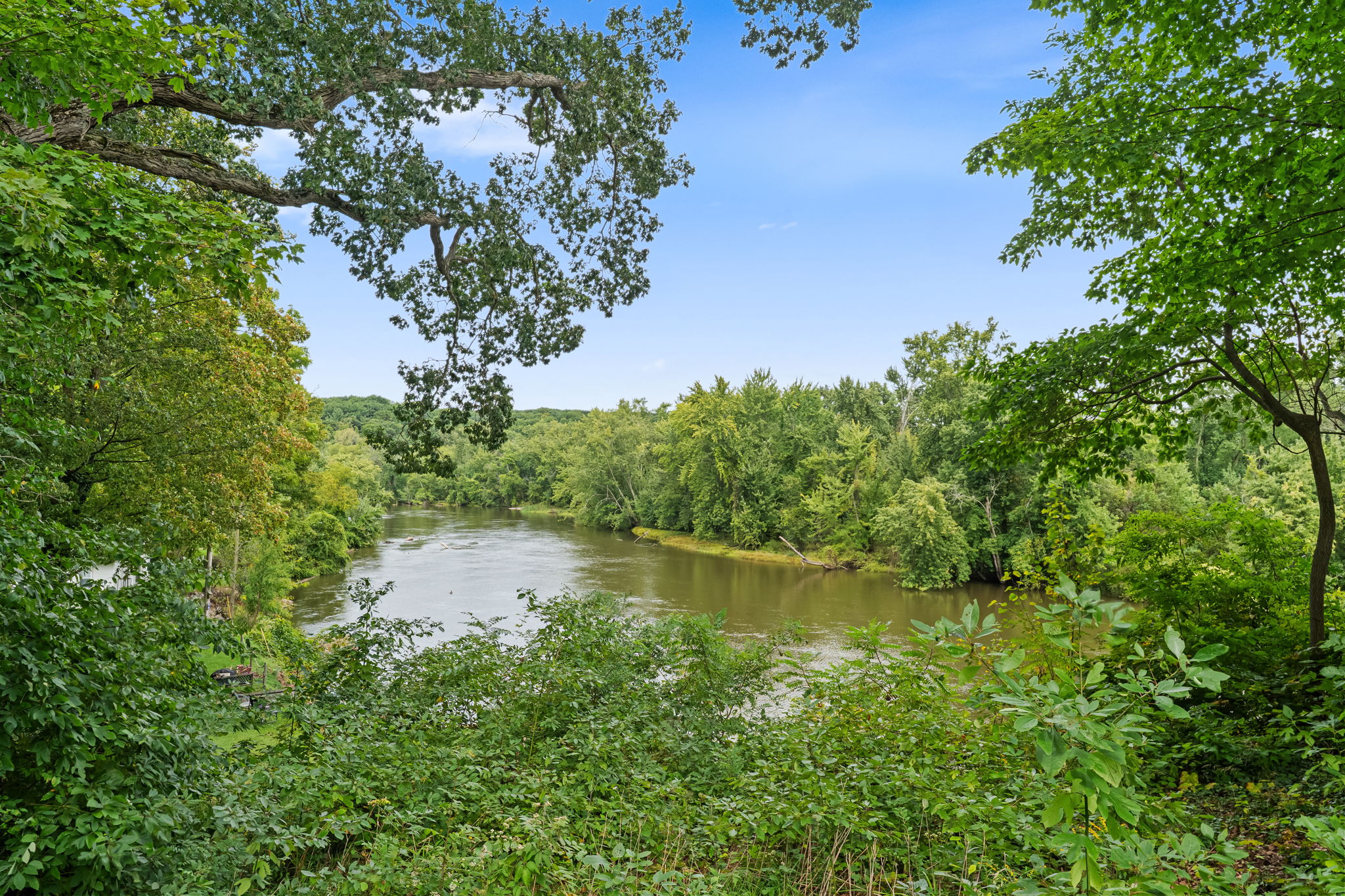 Peaceful river views surrounded by lush trees and natural beauty