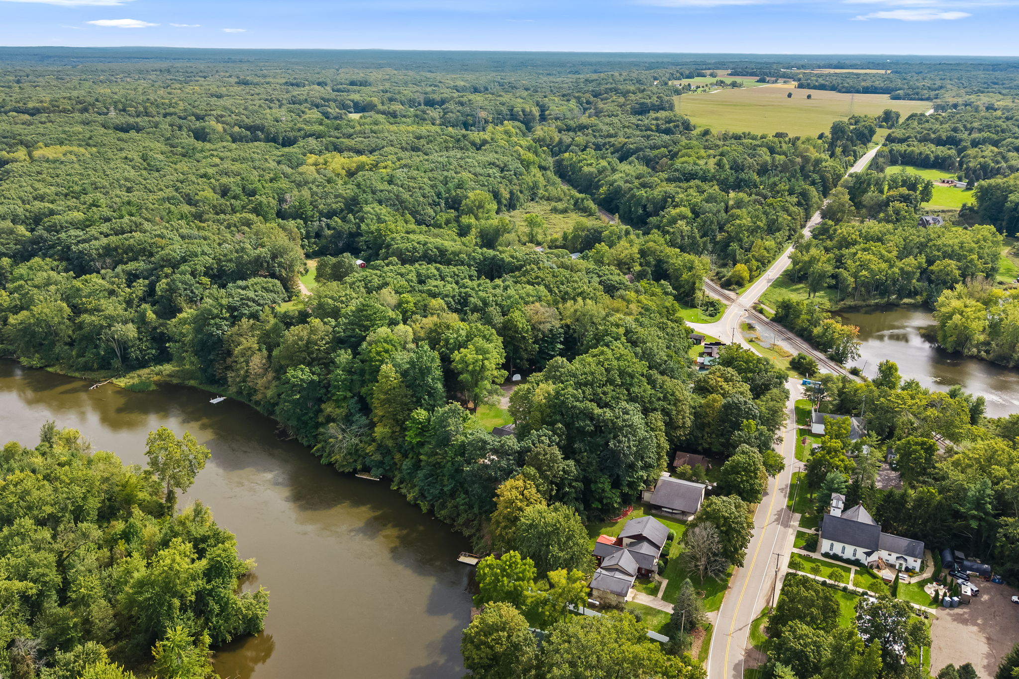Scenic riverfront setting surrounded by mature trees and peaceful nature