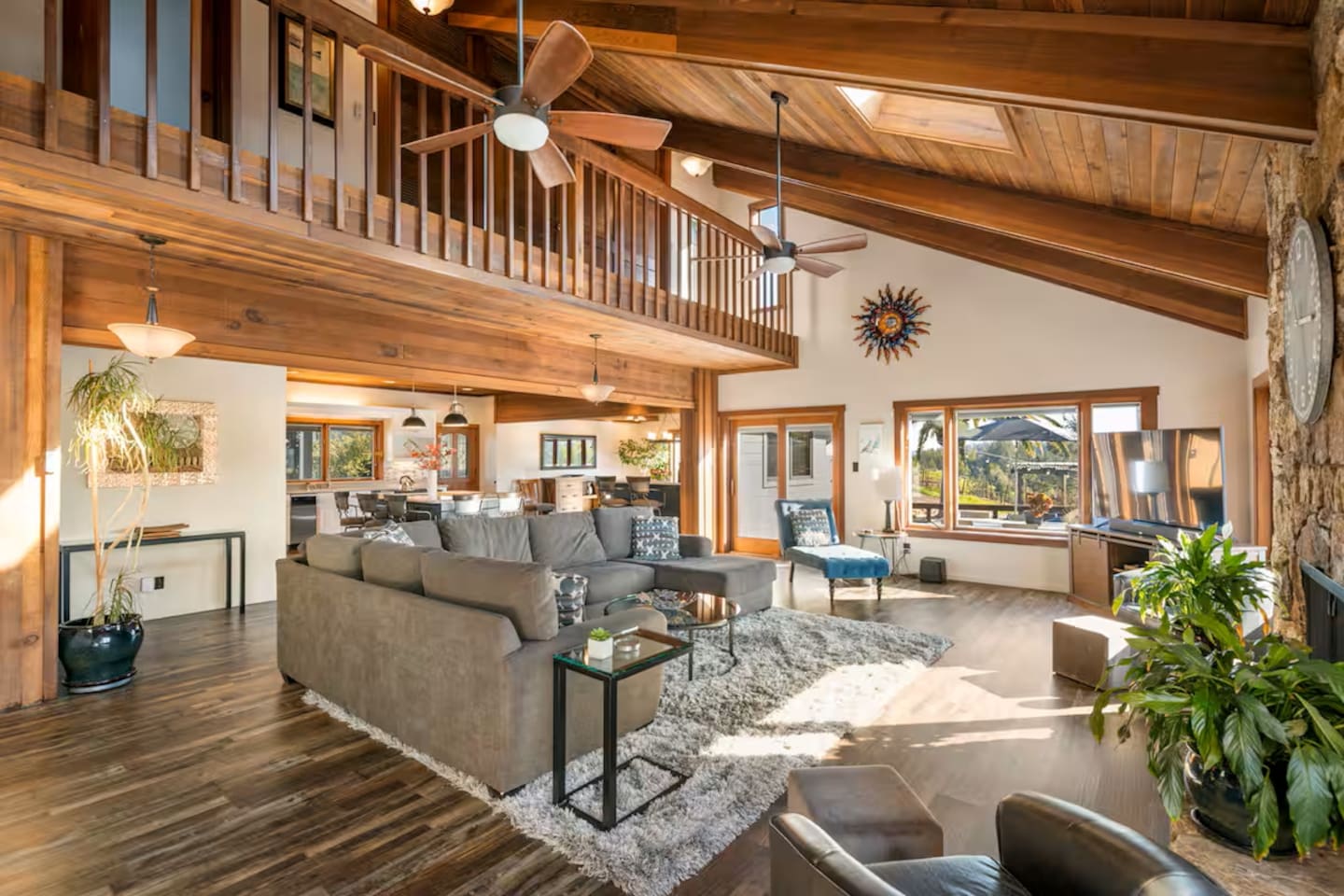 Experience the great room with its ceiling and elegant design. The seamless connection to the second floor, dining, and kitchen areas creates an open, airy feel, perfect for relaxed, expansive living and effortless entertaining.