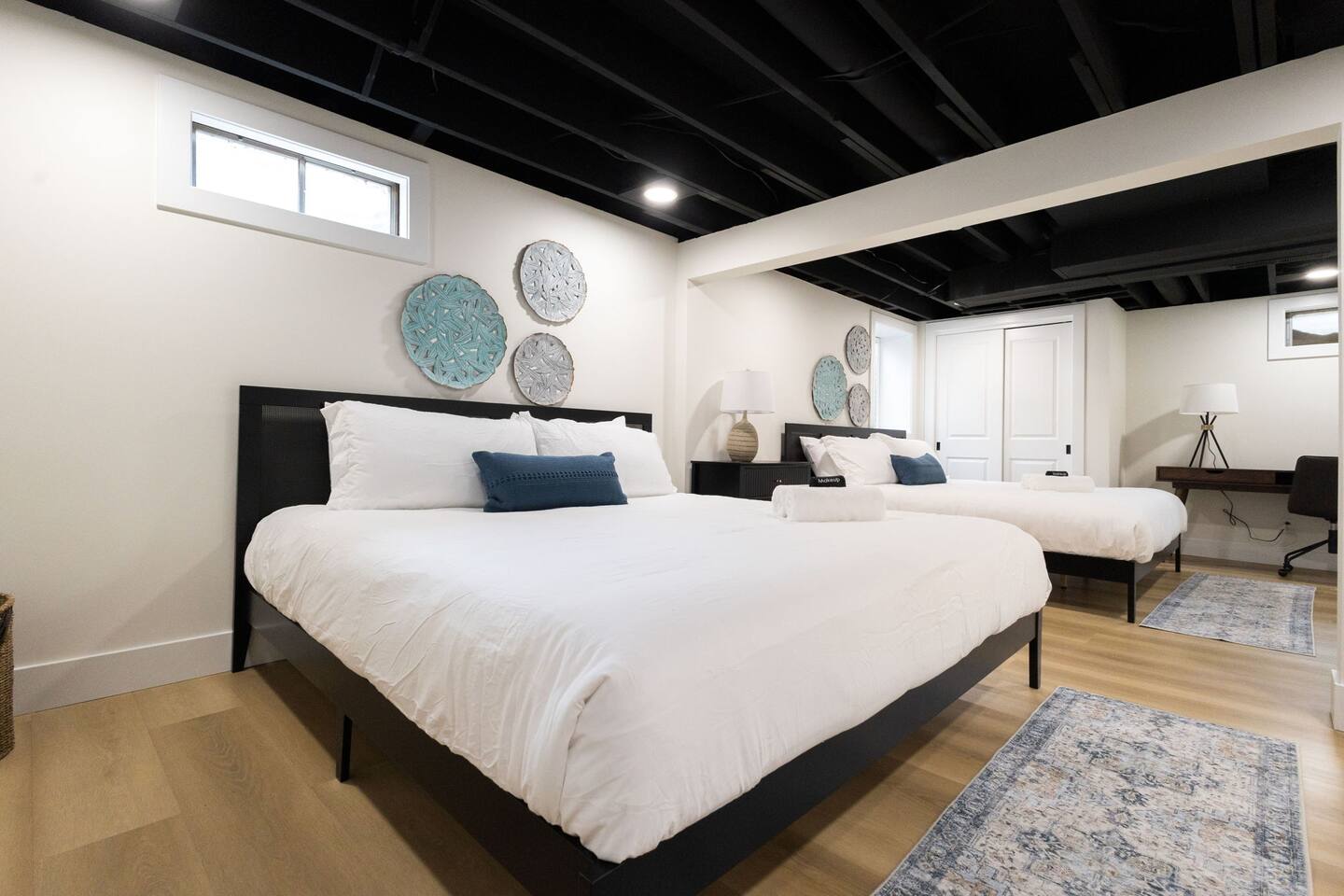 Lower-level bedroom with two beds