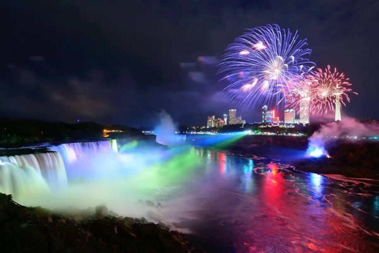 Nearby Niagara Falls view with colorful lights and fireworks, giving guests a memorable evening experience close to the stay.