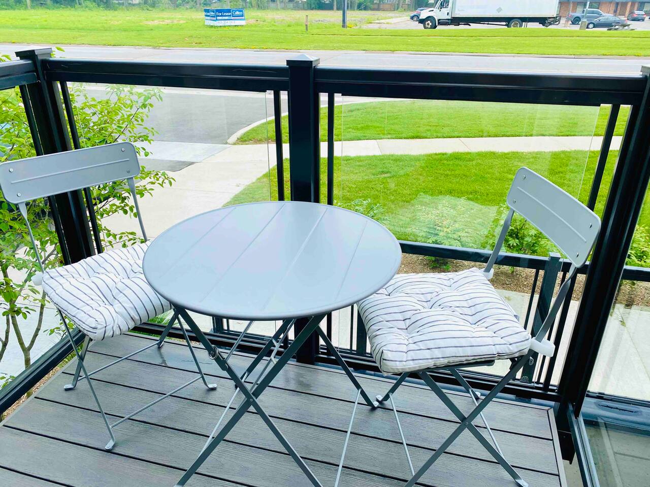Balcony Furniture Private balcony seating with a small table and chairs, offering a fresh outdoor spot for morning coffee or quiet downtime.