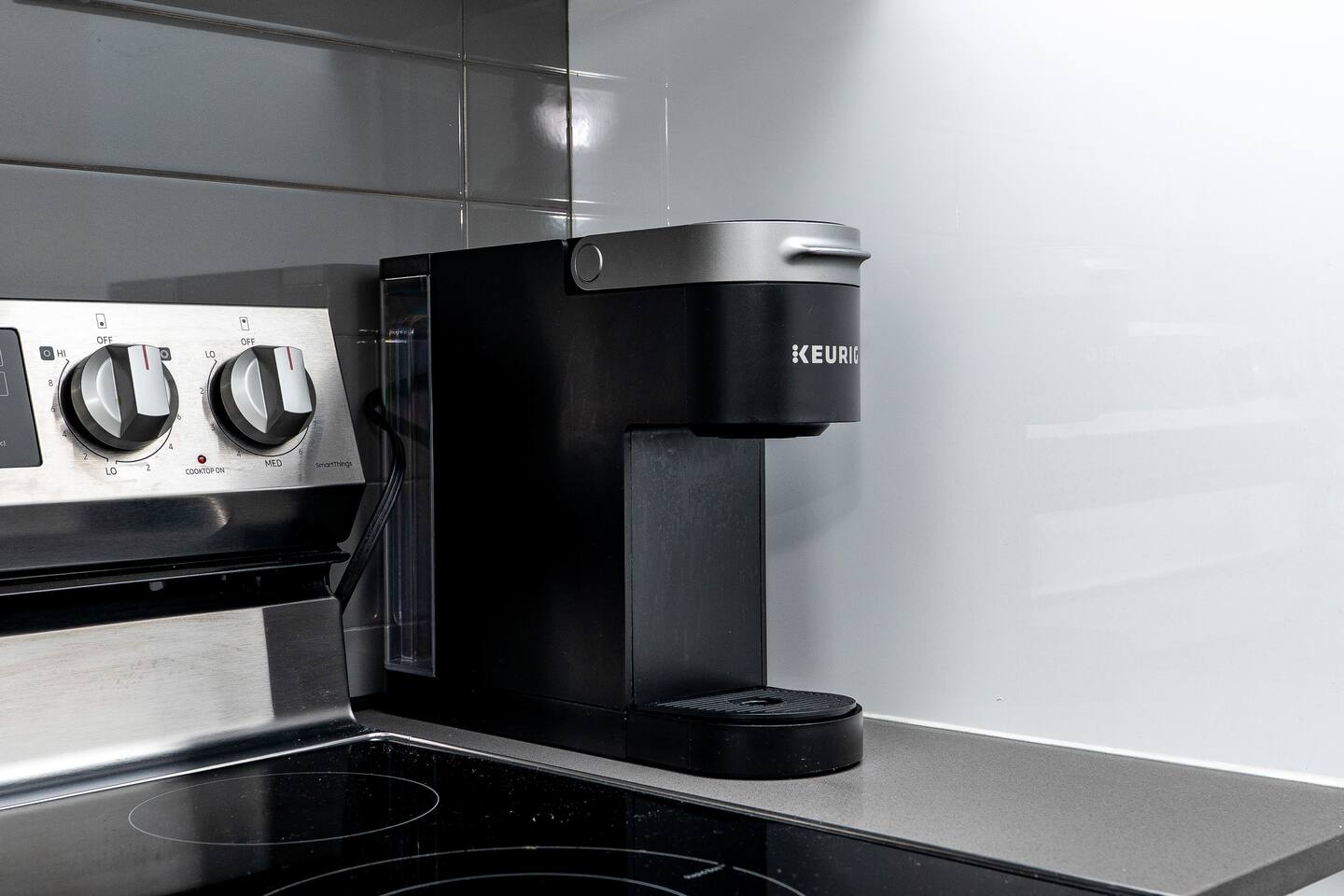 Coffee machine set on a sleek kitchen counter, adding an easy morning convenience for guests during their stay.
