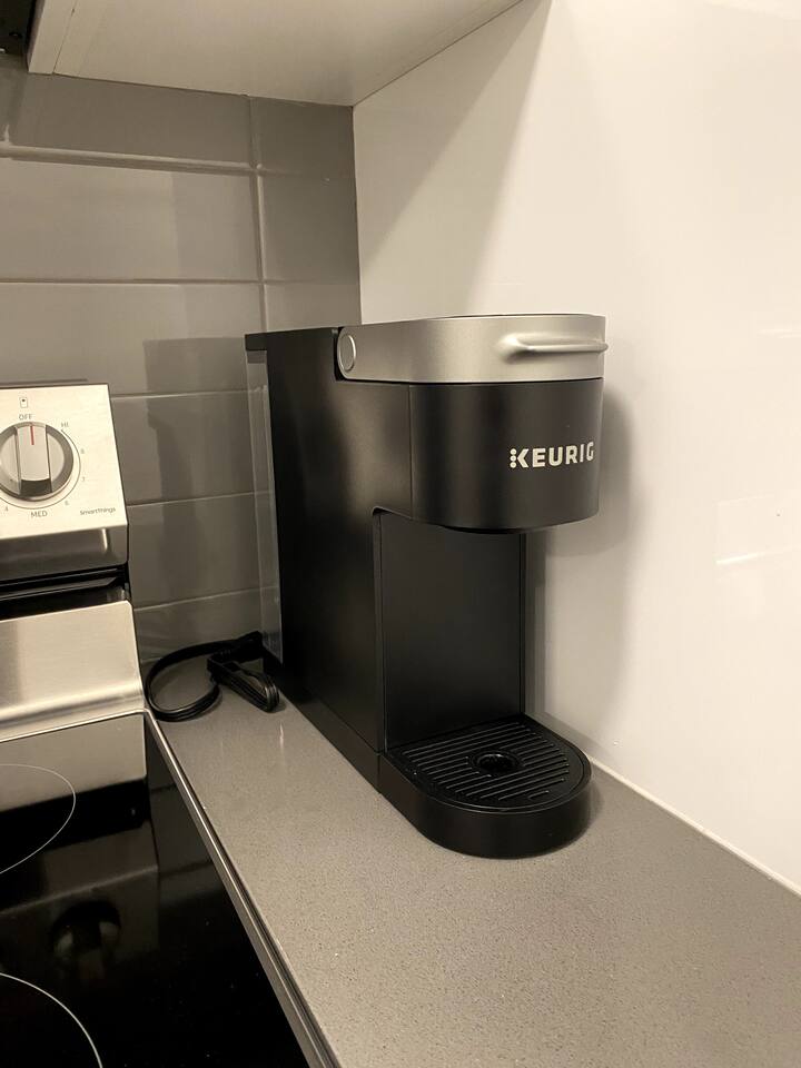 Keurig coffee maker on the kitchen counter for quick and convenient coffee during your stay.