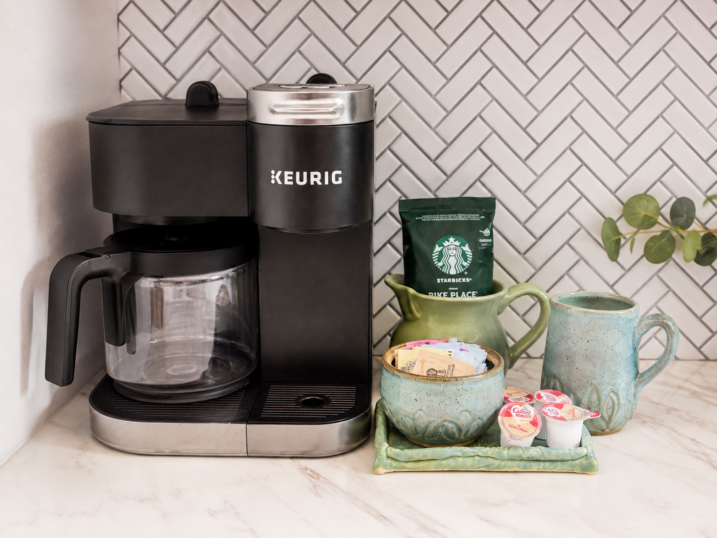 Stylish coffee station with Keurig, mug, and guest-ready essentials