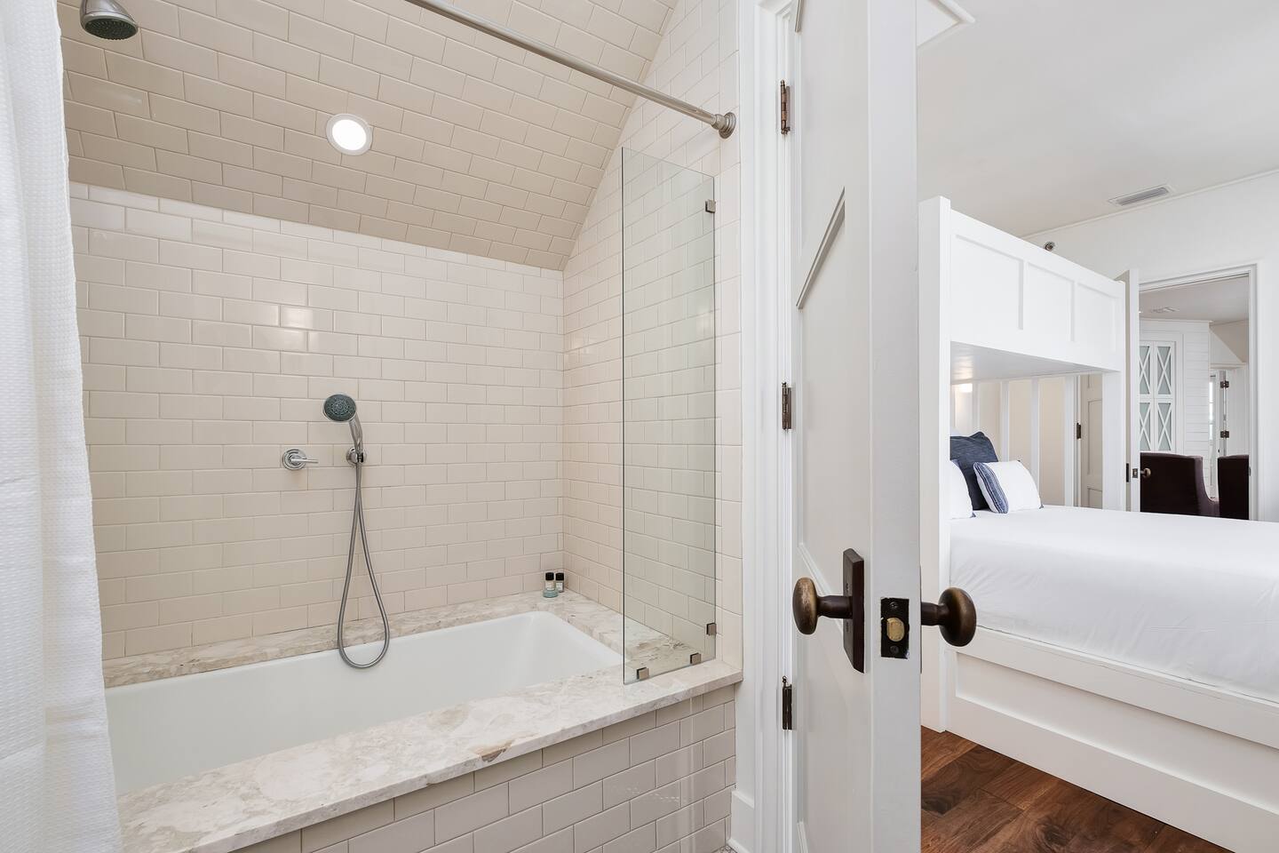 Bunk bath room with shower/tub combo