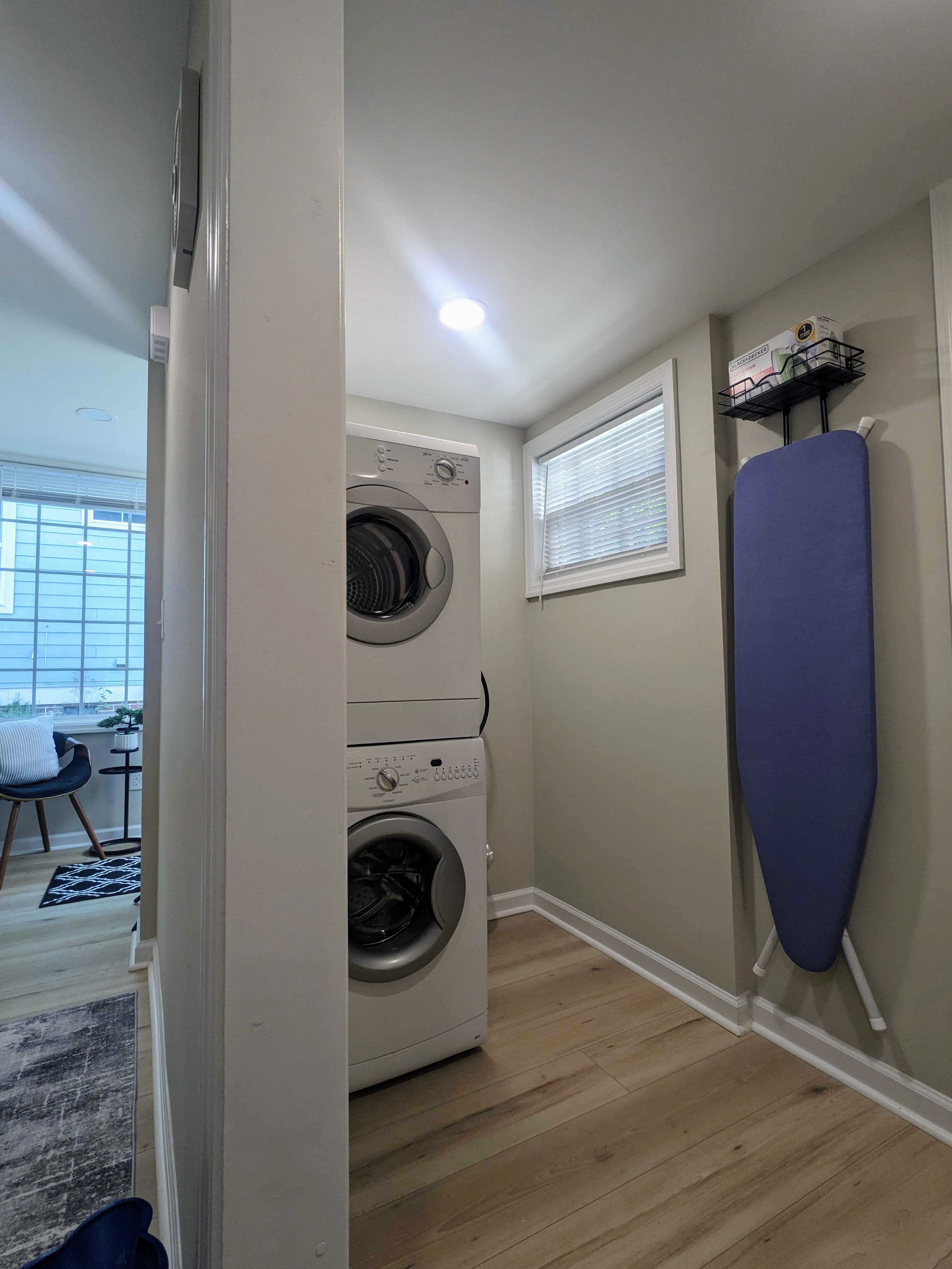 Convenient in-unit washer/dryer with ironing board and bright natural light