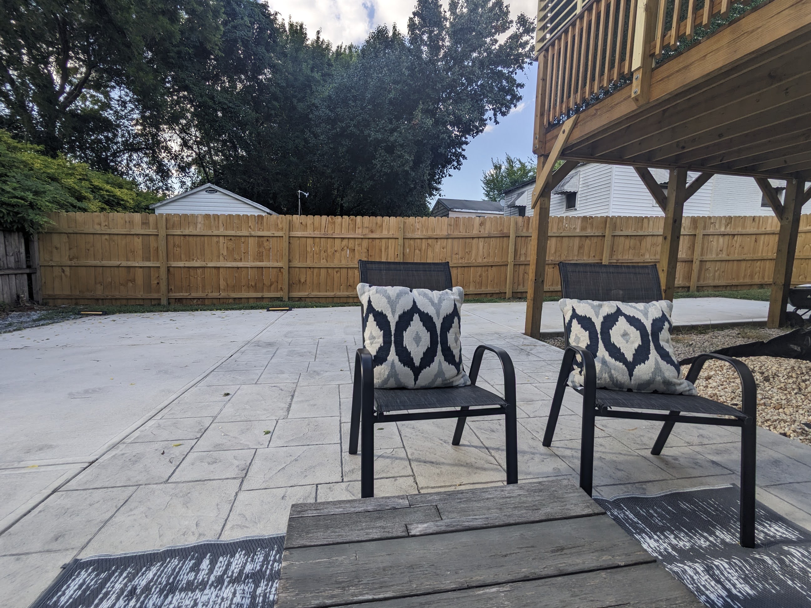 Private fenced patio with lounge seating and spacious outdoor hangout