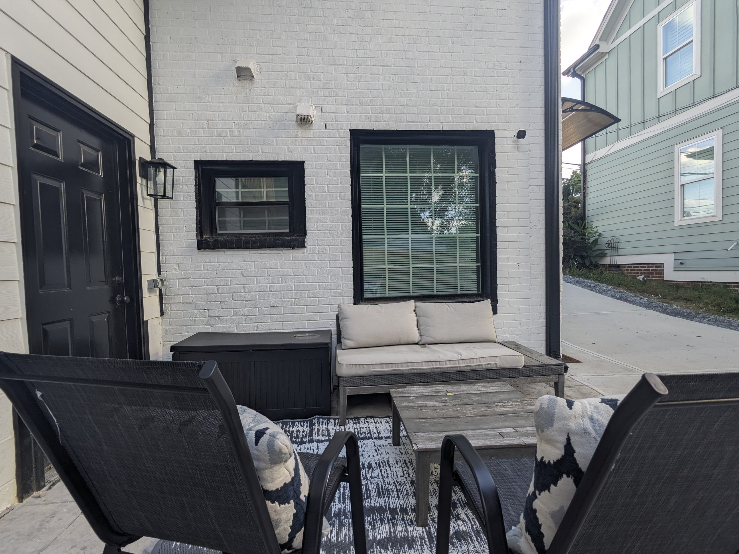 Cozy private patio with cushioned seating and stylish modern touches