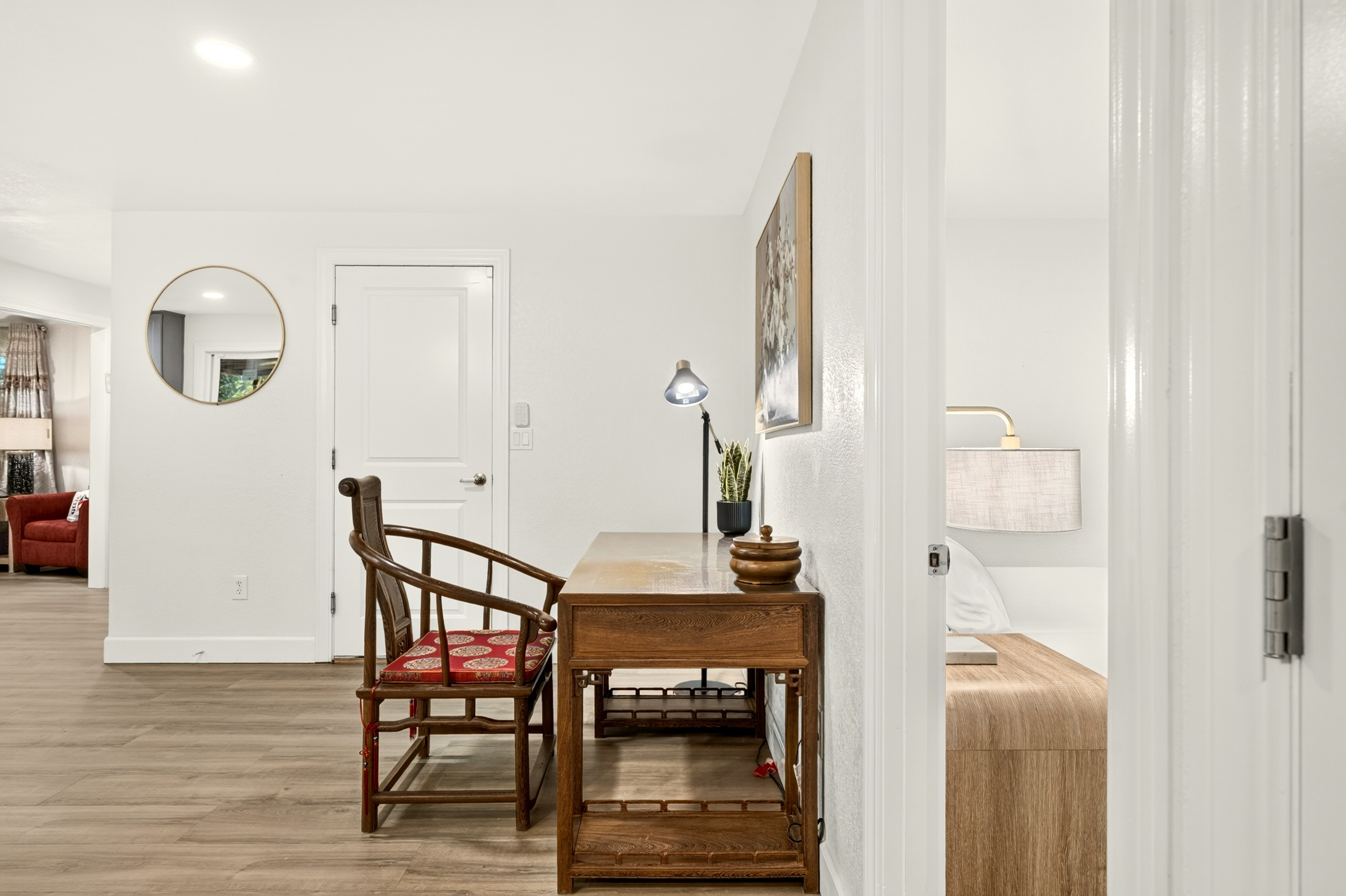 Bright hallway workspace with warm wood accents and easy bedroom access