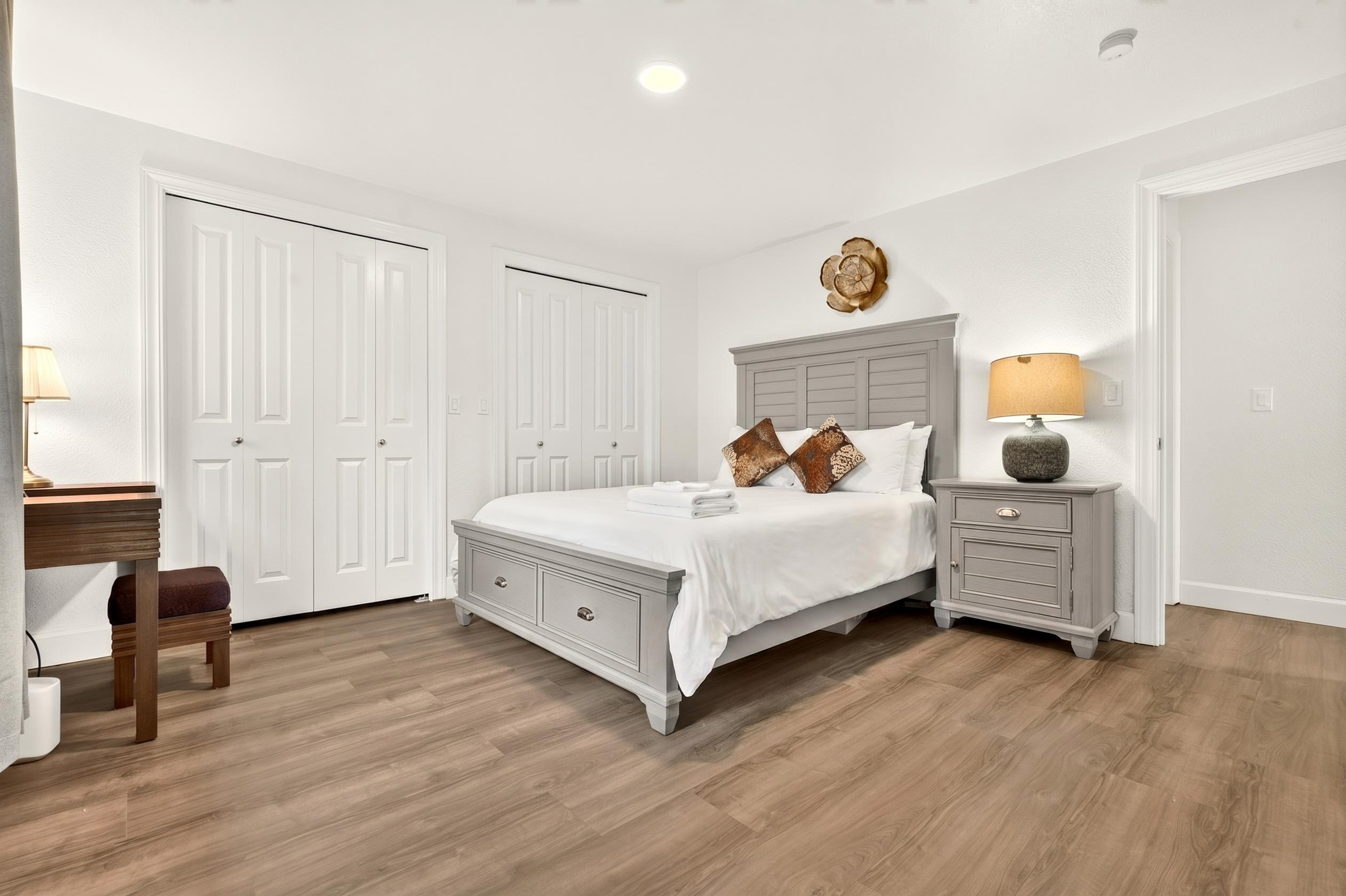 Bright, spacious bedroom with two large closets and stylish furnishings