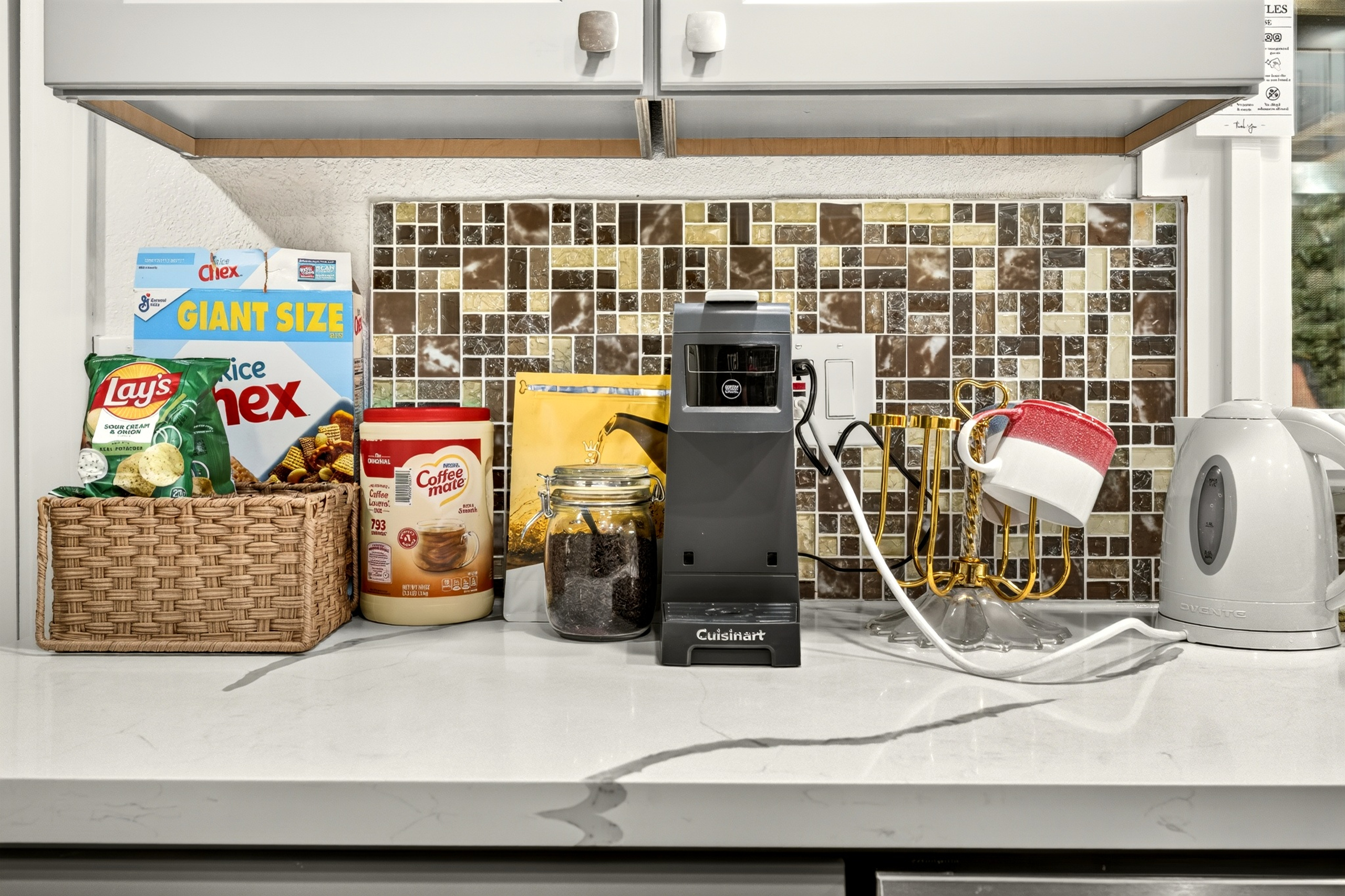 Guest-ready coffee and snack station in a bright, modern kitchen