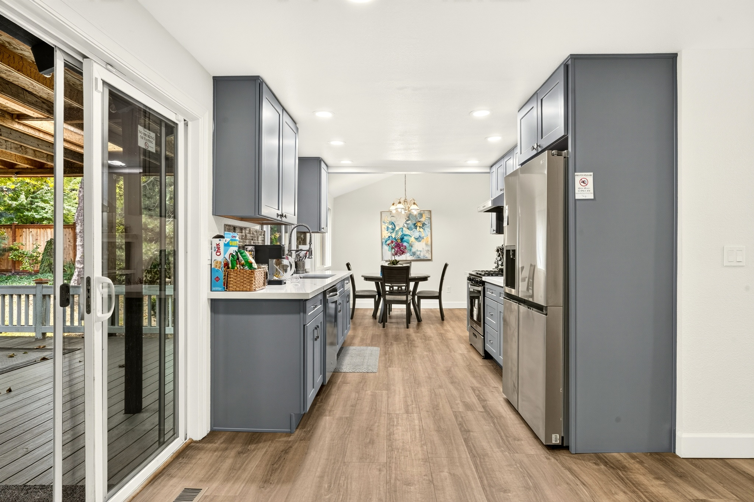 Bright modern kitchen with deck access and cozy dining nook