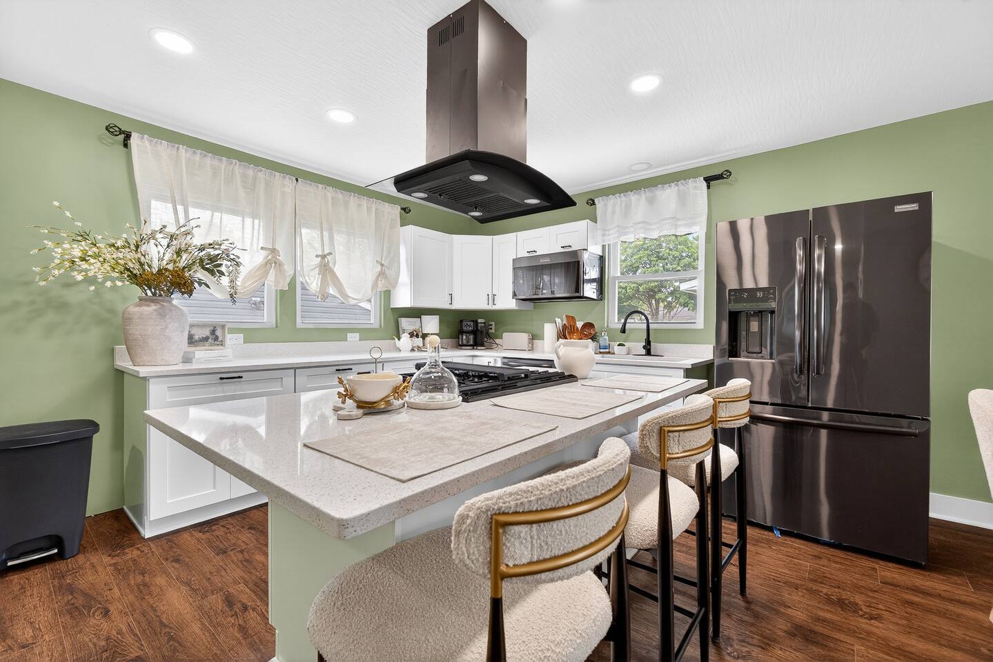 Sage-green kitchen at a Stellar-managed home