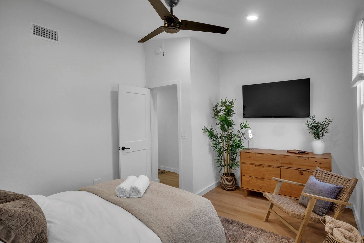 Bedroom 2 has plenty of storage for clothes, and a place to sit and relax, read a book.  Very large walk in closet.  Full length mirror and luggage racks included.