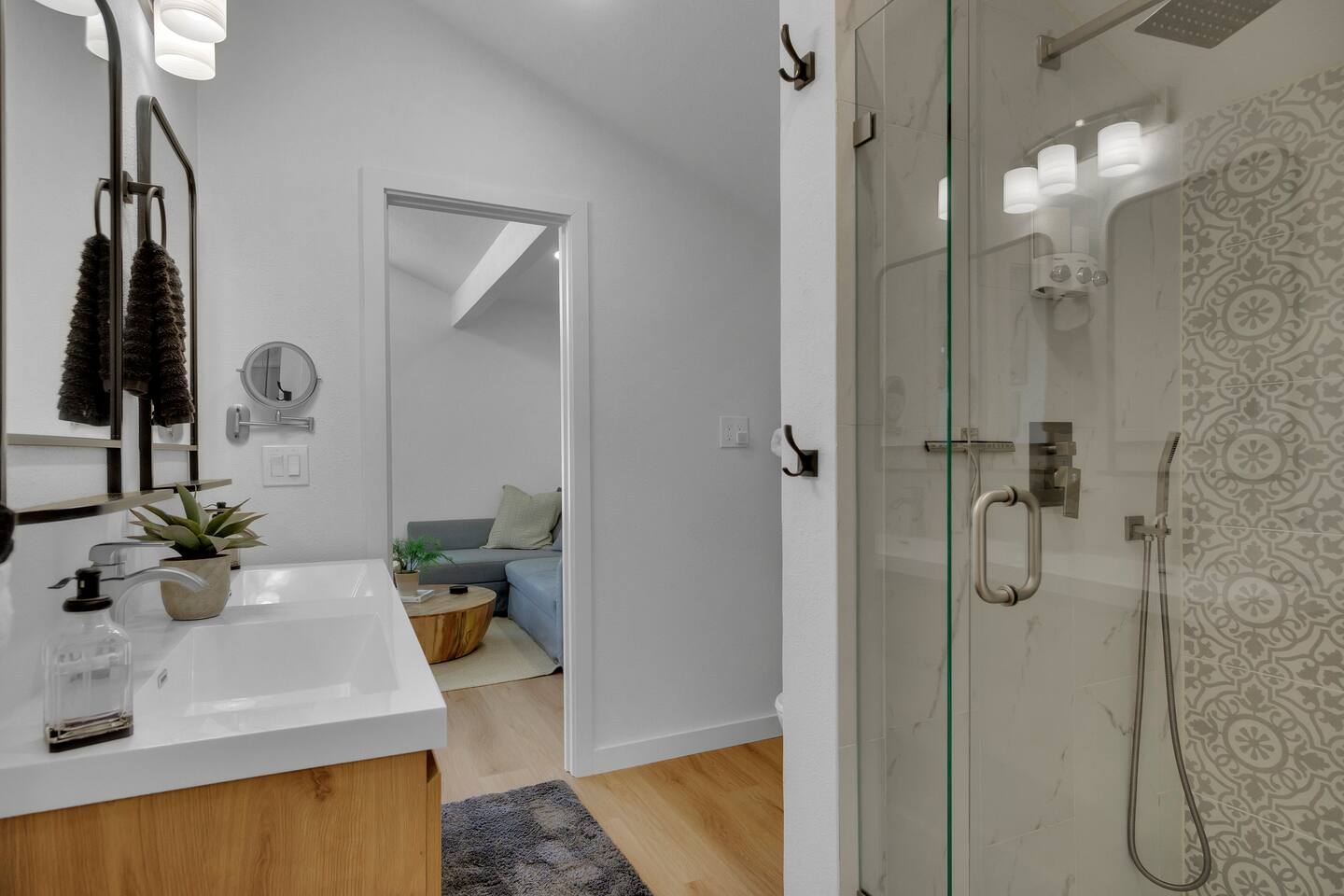Jack and Jill shared bathroom with double sink and shower for bedrooms 2 and 3.