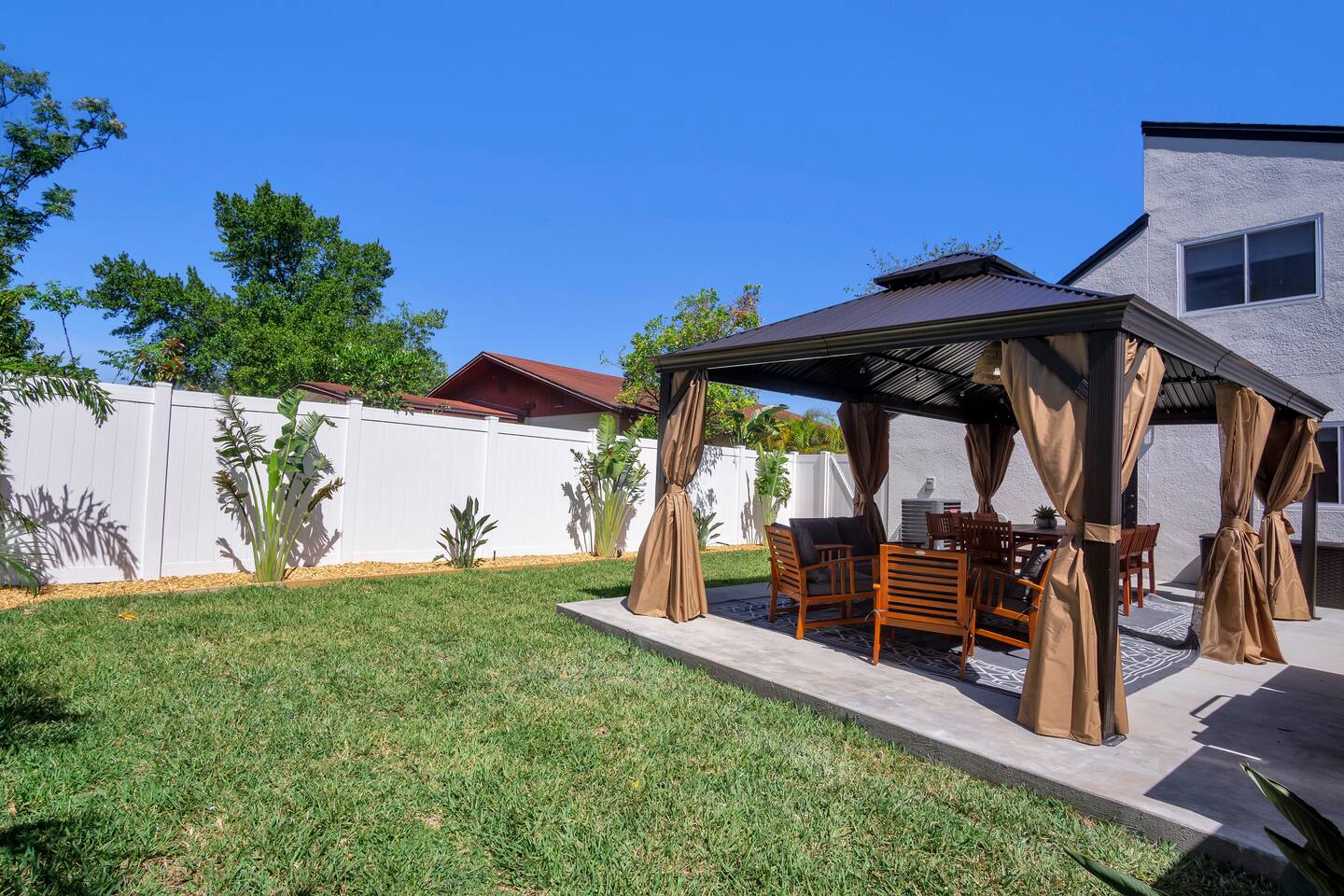 Large back yard for enjoying time with friends and family. Play games, bbq, relax and entertain.