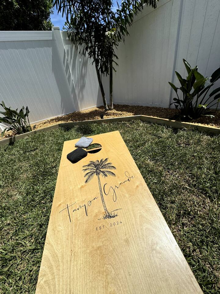 Enjoy a game of Cornhole provided in our backyard. .