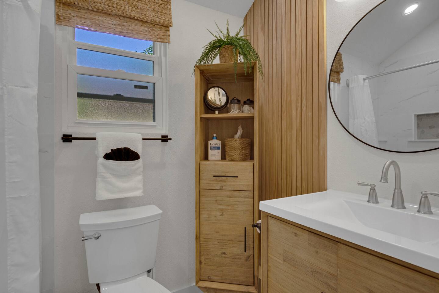 Bathroom one downstairs full bath with tub and shower shared with bedroom 1 .