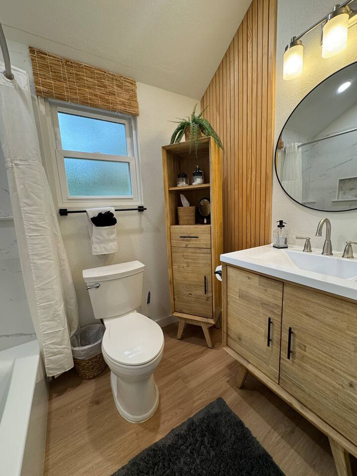 Downstairs full bathroom with tub and shower.   Bathroom for guests in bedroom 2