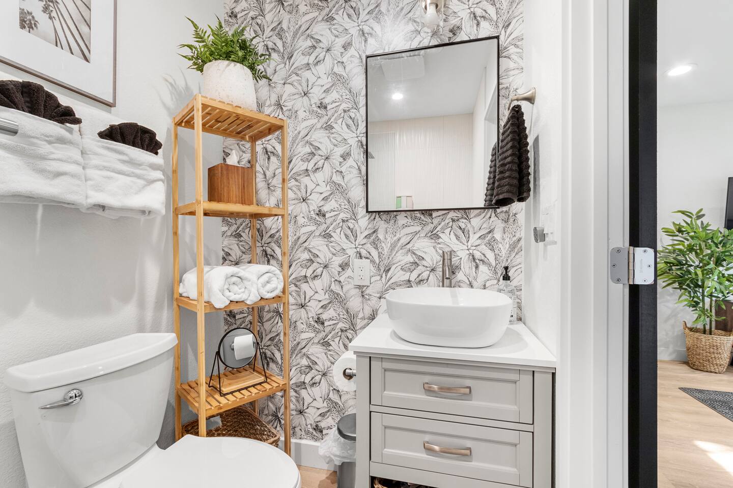 tiny but efficient bathroom with full walk in shower and extra little essentials you may have forgotten.