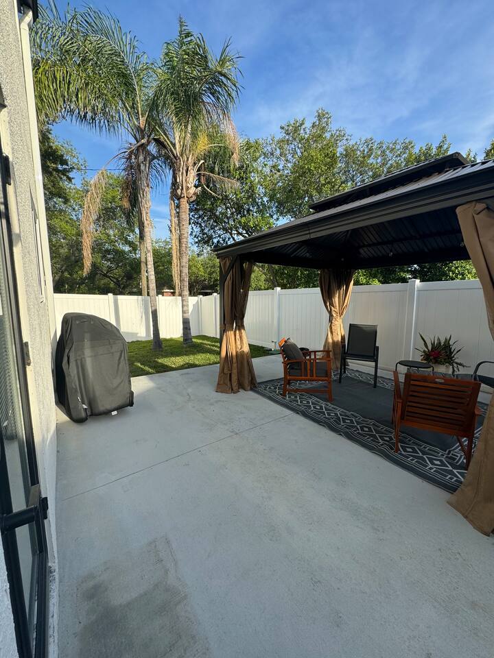 Private gated and locked backyard.  BBQ grill, grassy area and covered patio.  Screens for protection from bugs.