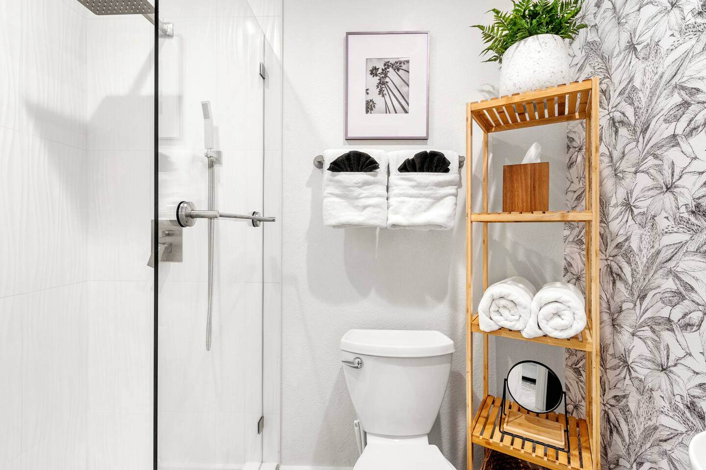 Small bathroom with everything you need and lots of towels.