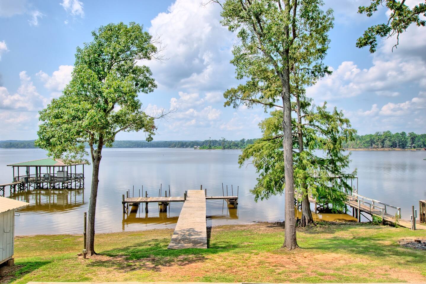 Docks on Toledo Bend Lake under tall trees