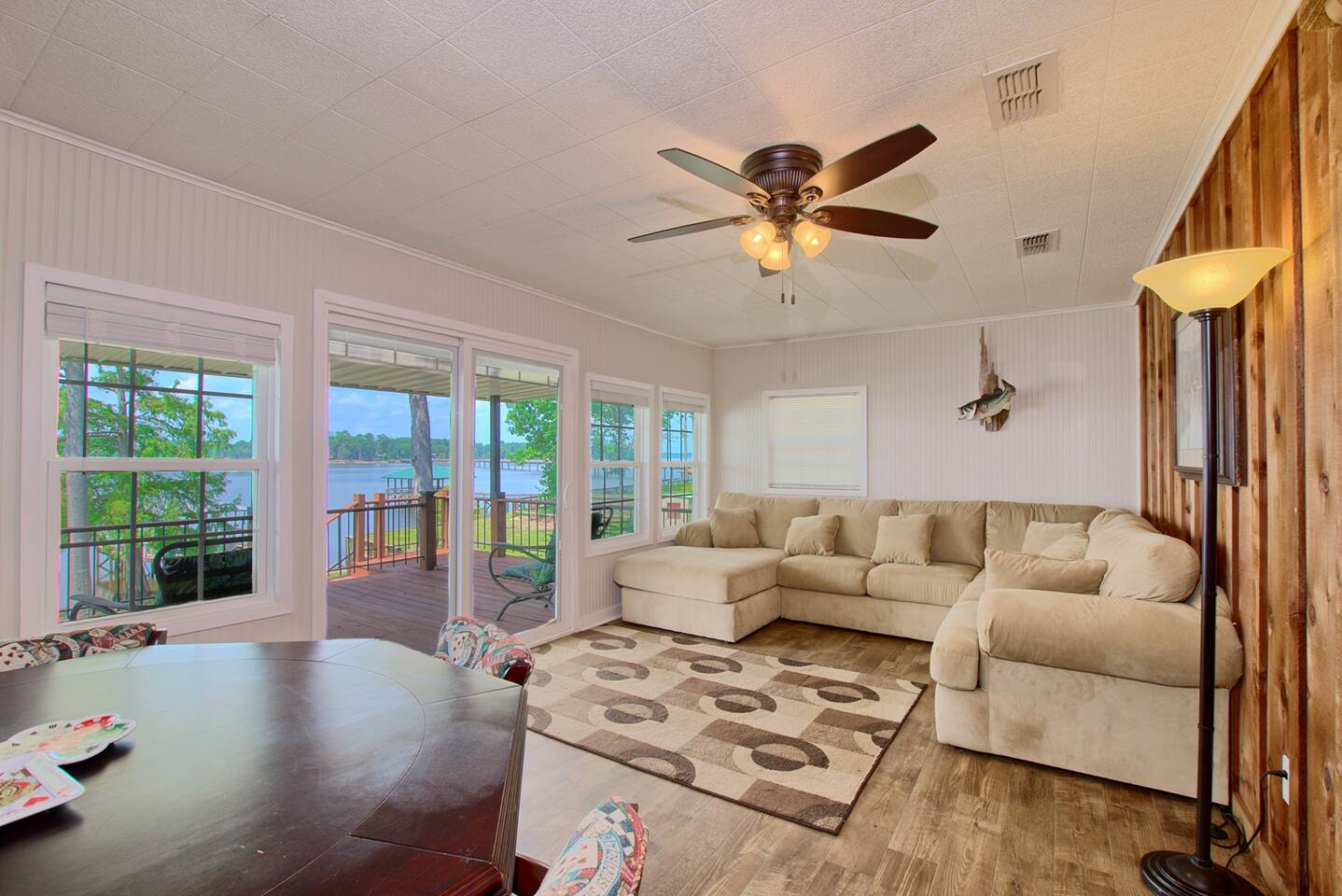 Living room with windows looking out at the lake