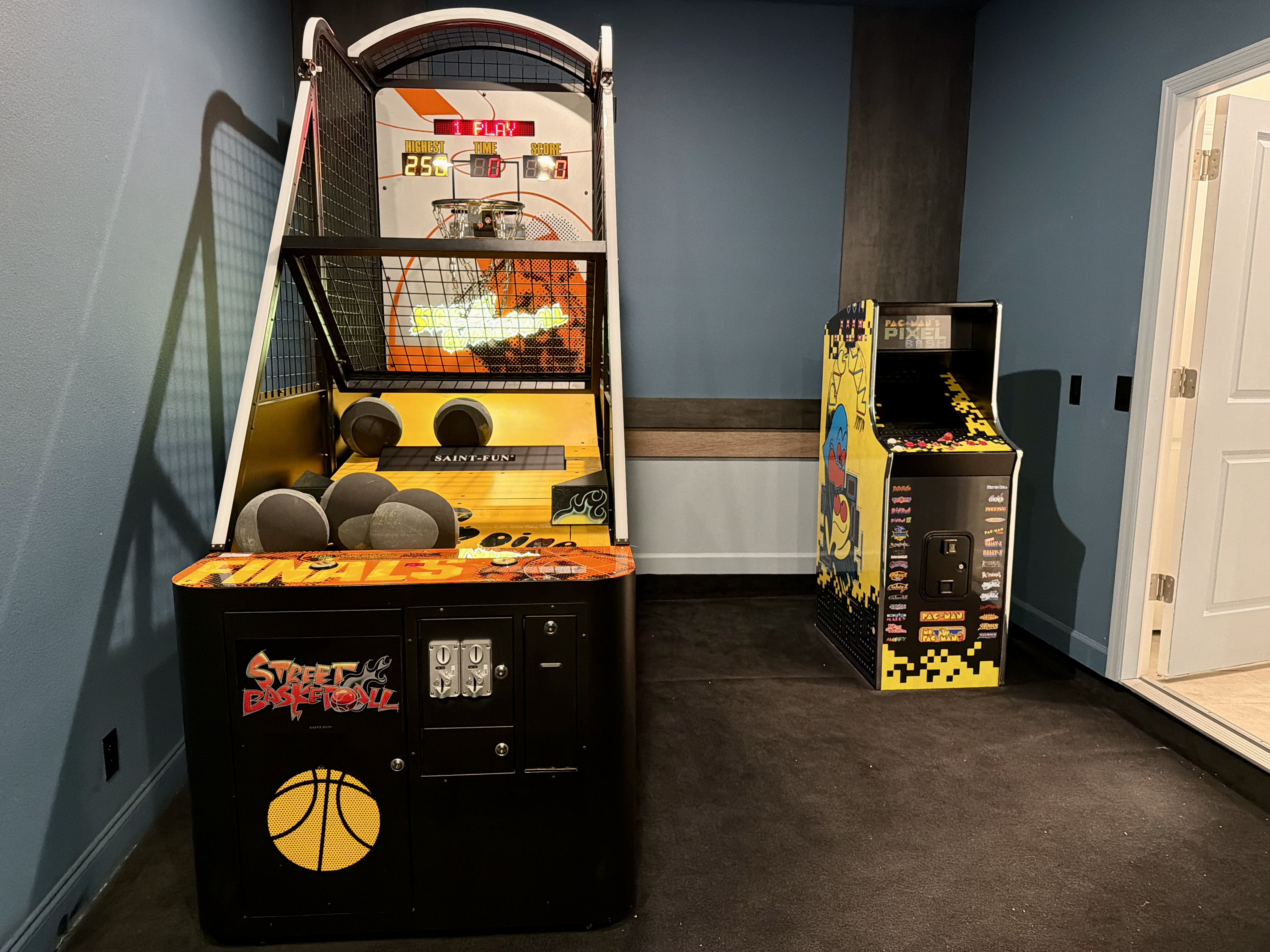 Private game room with basketball arcade and retro gaming fun